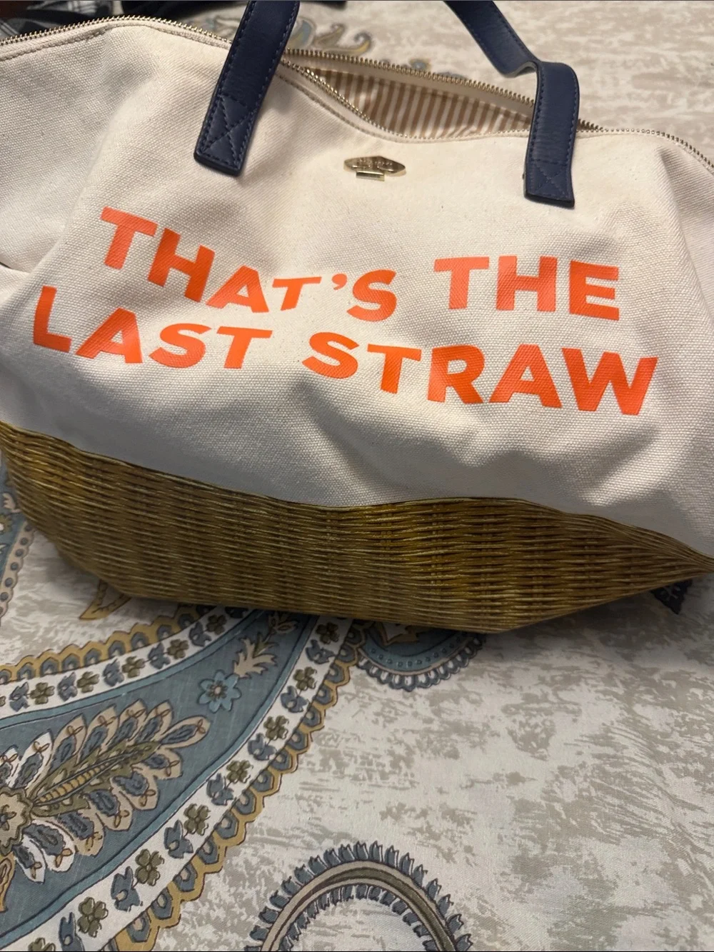 kate spade canvas tote with orange That’s the last straw text and blue handles.